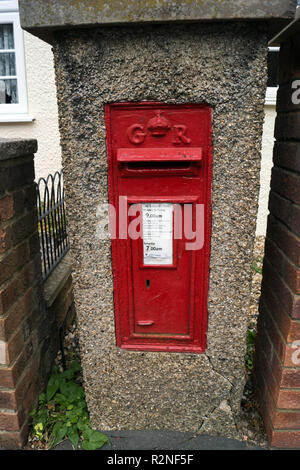 A concrete mounted Royal mail collection box in Lower Sheering, Essex from the reign of King George VI, ER, in a concrete render. Stock Photo