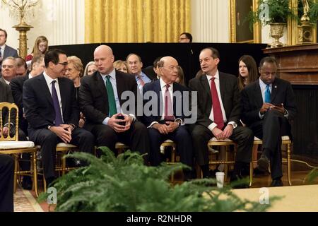 Members of the Cabinet attend the Presidential Medal of Freedom award ceremony in the East Room of the White House November 16, 2018 in Washington, D.C. Sitting from left to right are: Secretary of State Mike Pompeo, Treasury Secretary Steve Mnuchin, Acting United States Attorney General Matt Whitaker, Commerce Secretary Wilbur Ross, Labor Secretary Alex Acosta and HUD Secretary Ben Carson. Stock Photo