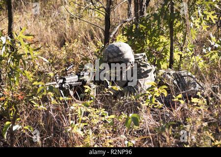 South Carolina Army National Guard Soldiers from 4th Battlion, 118th Regiment and 174th Engineer Company conduct combined arms breaching exercises at McCrady Training Center, Eastover, S.C., Nov. 3, 2018.  The 4th Battalion infantry companies practiced attacking an objective using support from the 174th engineer mobility assault platoons for obstacle reduction, destruction and short-gap crossings.  The combined forces breached wired obstacles using simulated M58 Mine Clearing Line Charge (MICLIC) rockets, cleared minefields with an M9 Armored Combat Earthmover (ACE), and placed a bridge over a Stock Photo