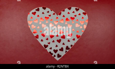 Artistic red hearts on red frame Stock Photo