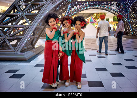 Thai children. Three cute young girls in traditional dress posing at Terminal 21 shopping mall, Pattaya, Thailand, Southeast Asia Stock Photo