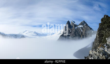 View of Orne Harbour glacier in mist from Spigot Peak, Antarctic Peninsula, Antarctica Stock Photo