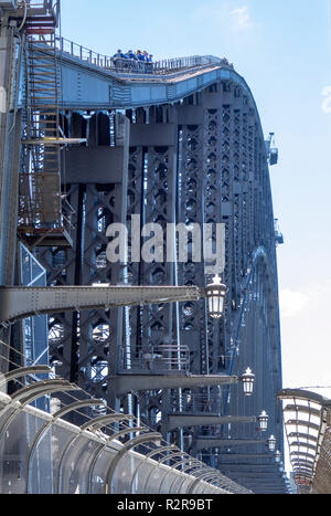 Small group of people climbing the Sydney Harbour Bridge a popular sightseeing activity Sydney NSW Australia. Stock Photo