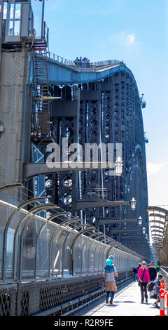 Small group of people climbing the Sydney Harbour Bridge a popular sightseeing activity Sydney NSW Australia. Stock Photo