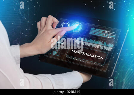 The concept of business, technology, the Internet and the network. A young entrepreneur working on a virtual screen of the future and sees the inscrip Stock Photo