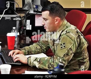 Cpt. Valentin J. Boza, a supply and logistics officer assigned to the 4th Sustainment Brigade, 4th Infantry Division, prepares documents while deployed in support of Operation Border Support at Fort Sam Houston, TX, Nov. 5, 2018. The 4th Sustainment Brigade is assisting the United States Customs and Border Patrol and the Department of Homeland Security with planning assistance and logistical reinforcement. Stock Photo