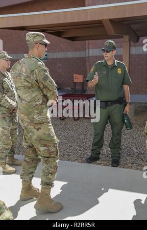Supervisory U.S. Border Patrol Agent Neil Brady briefs Soldiers assigned to 937th Route Clearance Company, 20th Engineer Battalion, 36th Engineer Brigade about the capabilities of border patrol in Bisbee, Arizona, November 6, 2018. U.S. Northern Command is providing military support to the Department of Homeland Security and U.S. Customs and Border Protection to secure the southern border of the United States. Stock Photo