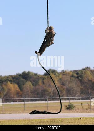 U.S. Army Ranger soldiers fast rope from a USA UH-60 Black Hawk ...