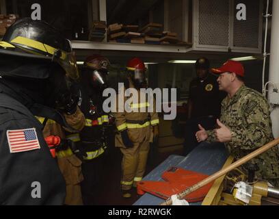 https://l450v.alamy.com/450v/r2rwgk/polaris-point-nov-8-2018-cmdr-tony-pecoraro-executive-officer-aboard-the-submarine-tender-uss-frank-cable-as-40-gives-training-to-sailors-assigned-to-frank-cable-and-department-of-defense-civilian-firefighters-assigned-to-naval-base-guam-fire-department-during-an-integrated-fire-drill-nov-8-frank-cable-forward-deployed-to-guam-repairs-rearms-and-reprovisions-deployed-us-naval-forces-in-the-indo-pacific-region-r2rwgk.jpg