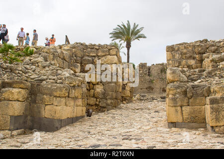 5 May 2018 Tourists at the Bronze Age entrance to the excavated ruins of the ancient city of Meggido in Northern Israel. This place is otherwise known Stock Photo