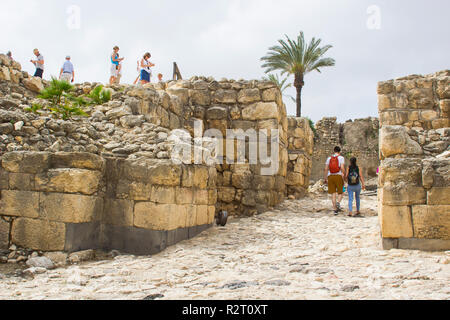 5 May 2018 Tourists at the Bronze Age entrance to the excavated ruins of the ancient city of Meggido in Northern Israel. This place is otherwise known Stock Photo