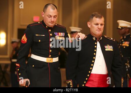 Col. Sean C. Killeen, commanding officer of Headquarters and Service Battalion, escorts Cpl. Matthew Bradford (Ret.) during Headquarters and Service Battalion’s 243rd Marine Corps Birthday celebration at the Westin Hilton Head, South Carolina, Nov. 9, 2018.  Killeen is the commanding officer of Headquarters and Service Battalion and Bradford was the guest of honor for the birthday celebration. Stock Photo