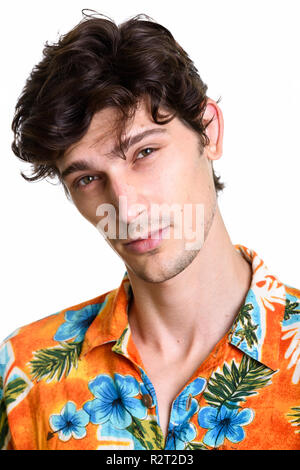 Face of young handsome man wearing Hawaiian shirt Stock Photo