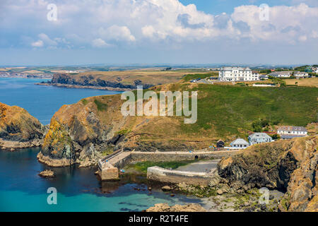 Looking north along the west coast of The Lizard, Mullion Cove and Mullion Hotel Stock Photo