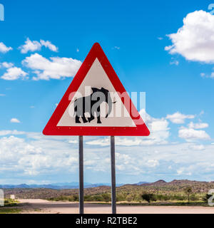 Elephants crossing road warning sign, Damaraland, Namibia Stock Photo