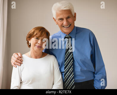 Portrait of a senior businessman and his wife at home. Stock Photo