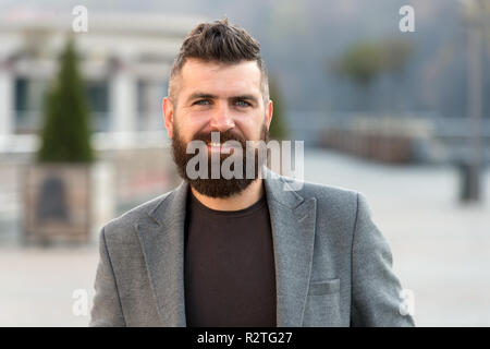 Outdoor Portrait Of Stylish Old Smiling Man With Long Grey Hipster