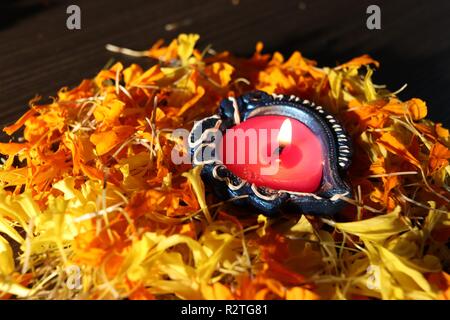 Lit diya placed on table for celebrating festival of lights in India Stock Photo