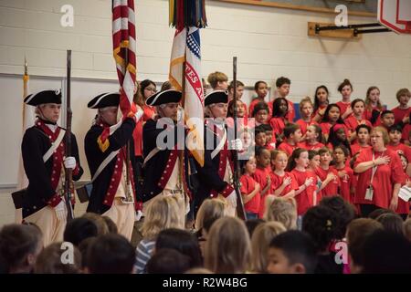 Soldiers assigned to the Continental Color Guard, 3d U.S. Infantry Regiment (The Old Guard), perform for the Veterans Day celebration at Clermont Elementary School in Alexandria, Virginia, Nov. 12, 2018. During the celebration, the Continental Color Guard presented the nation’s colors for the playing of the national anthem and the reciting of the Pledge of Allegiance. Stock Photo