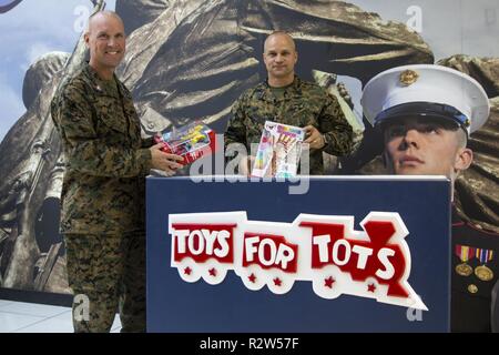 Marine Corps Base Camp Lejeune – Col. Scott Baldwin, acting commander, Marine Corps Base Camp Lejeune and Sgt. Maj. Charles Metzger, MCB Camp Lejeune Sgt. Maj., kicked off this year’s Toys for Tots on Camp Lejeune, Nov. 8. Each year since 1947, U.S. Marines throughout the United States conduct local Toys for Tots campaigns from October through December. “I just think every child should have a toy for Christmas,” said Staff Sgt. William Gillespie, Toys for Tots Coordinator, Eastern North Carolina. “Giving back like this brings the community closer together.” Stock Photo