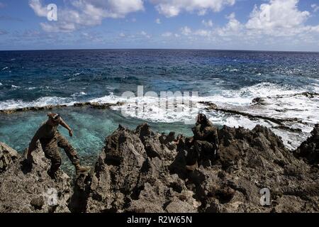 https://l450v.alamy.com/450v/r2w65n/sgt-ashlie-lowe-climbs-toward-sgt-byron-meekins-along-the-east-coast-of-tinian-commonwealth-of-the-northern-mariana-islands-nov-13-2018-marines-with-the-31st-marine-expeditionary-unit-and-clb-31-have-been-leading-the-multi-service-department-of-defenses-defense-support-of-civil-authorities-relief-efforts-here-since-oct-29-in-the-wake-of-super-typhoon-yutu-which-wreaked-havoc-as-the-second-strongest-storm-to-ever-hit-us-soil-on-oct-25-tinian-host-of-a-1944-wwii-battle-during-the-marianas-campaign-is-part-of-the-us-commonwealth-of-the-northern-mariana-islands-more-than-320-mar-r2w65n.jpg