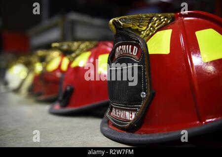 Helmets worn by Fairchild's firefighters wait to be worn in the equipment room for live fire training at Fairchild Air Force Base, Washington, Nov.8, 2018. Fairchild's base leadership was able to experience the fire training first-hand in wearing the equipment and learning how to extinguish a live fire. Stock Photo