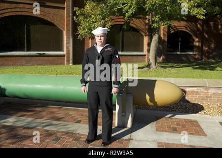 Electronics Technician (Nuclear) 2nd Class Billy Joe Moss poses for a photo outside of the USS Maryland off-crew building on Naval Submarine Base Kings Bay, Georgia. A native of Elkmont, Alaska, Moss, stationed aboard USS Maryland (SSBN 738) constantly prepares with his unit during in port periods to remain qualified for upcoming deployments and tactical exercises at sea. The USS Maryland is one of five ballistic-missile submarines stationed the base. Stock Photo