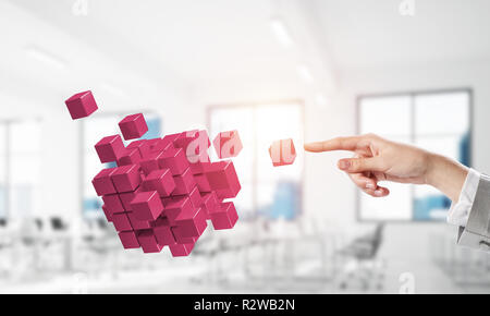 Integrating new technologies concept with cube figure floating i Stock Photo