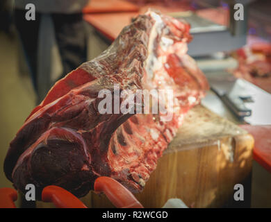 Florence, Italy - February, 2019. Aged Florentine steaks (Bistecca alla Fiorentina in Italian) on sale in the central market. Stock Photo