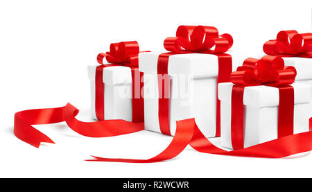 Christmas gift boxes with red ribbons on white background Stock Photo