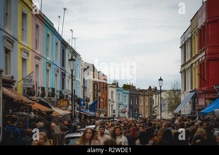 London, UK - February, 2019. Crowd of tourists and locals in Portobello Road, the world's largest antiques market  held every Sunday in Notting Hill. Stock Photo