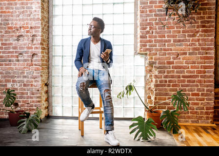 Businessman near brick wall Stock Photo - Alamy