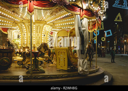 Perugia, Italy - January 2018. A vintage carousel situated along the main street of the city centre during Christmas time. Stock Photo