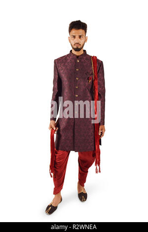 Indian bridegroom wears ethnic or traditional cloths, Male fashion model  with dark blue sherwani, posing / standing against brown grunge background,  selective focus photo – Portrait Image on Unsplash