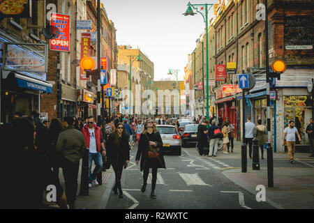 London, UK - February, 2019. A crowded Brick Lane on a Sunday afternoon. Stock Photo