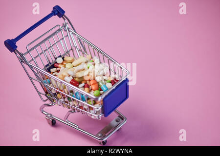 Buy medicines online concept with medicine in a shopping cart Stock Photo