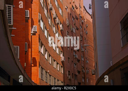 Orange brick building with concave wall, summer Stock Photo