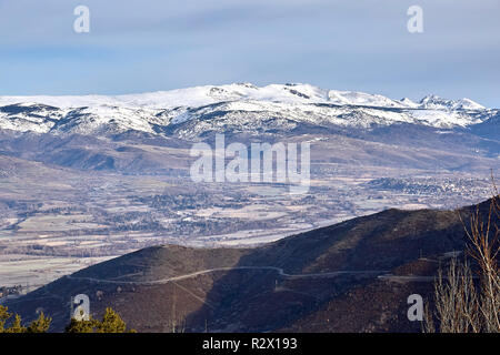 Beautiful mountain silhouette from Spain in winter, near the small village Alp Stock Photo