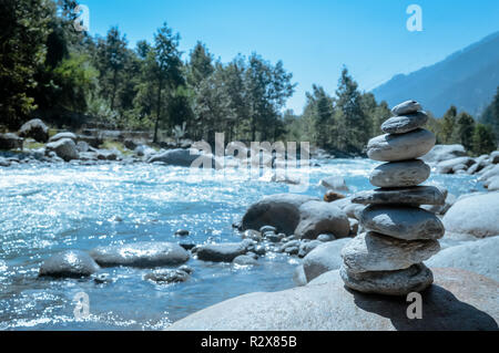 Heap of white stone stack of rock decoration in vertical style composition, copy space. Harmony, stability, strength, well being, concept. Useful in h Stock Photo