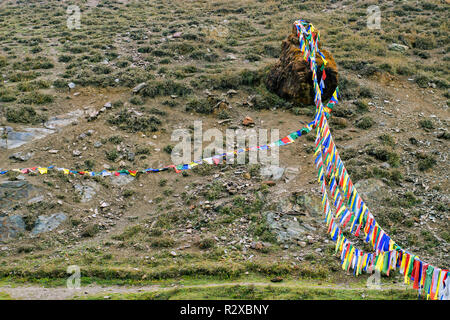Tibetan colorfull flags fluttering in the wind in the Himalayas. Buddhism concept. Stock Photo