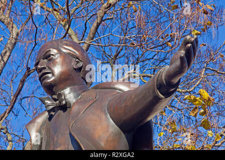 London, Westminster.   The somewhat controversial statue of David Lloyd George in Parliament Square, depicted in characteristic pose. Stock Photo