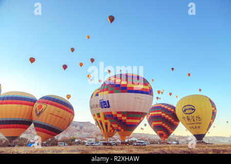 September 21, 2018 - Central Anatolia, Goreme, Turkey. Preparing hot air balloons to flyght. Dawn in Cappadocia. Stock Photo