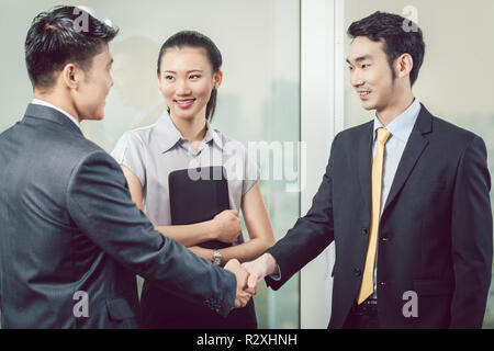 Businesspeople shaking hands Stock Photo