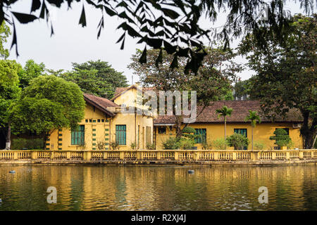 View across lake to house no 54 where President Ho Chi Minh lived in Presidential Palace grounds. Hanoi, Vietnam, Asia Stock Photo
