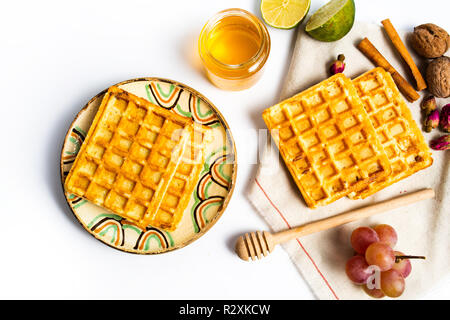 Homemade waffles served with fruits top view Stock Photo