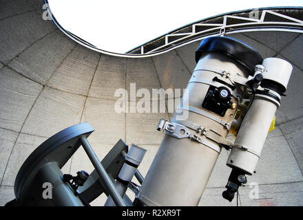 A reflector telescope under a  homemade dome Stock Photo