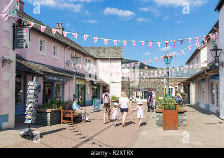 Lake district UK Keswick Lake District people shopping in Packhourse court an enclosed courtyard of shops in Keswick Cumbria England GB UK Europe Stock Photo