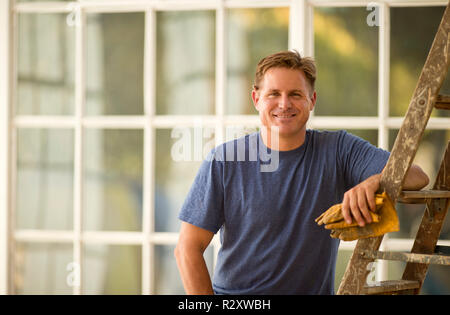 Businessman and builder discussing a construction project. Stock Photo