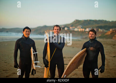 Portrait of smiling friends on a beach. Stock Photo