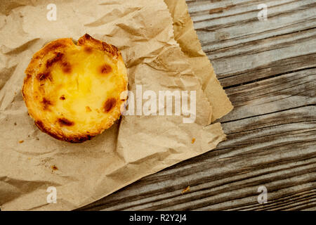 A homemade baked tart on a brown paper bag. Stock Photo
